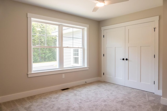 59 Sagamore Dr Lot 28, Phippsburg, ME 04562 - unfurnished bedroom featuring carpet, a closet, and a ceiling fan