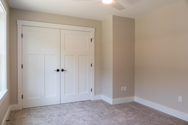 59 Sagamore Dr Lot 28, Phippsburg, ME 04562 - unfurnished bedroom with carpet, a closet, and ceiling fan
