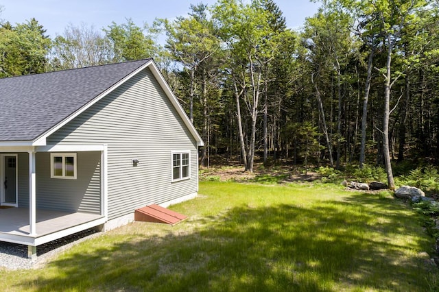 59 Sagamore Dr Lot 28, Phippsburg, ME 04562 - view of property exterior featuring roof with shingles, a yard, and a deck