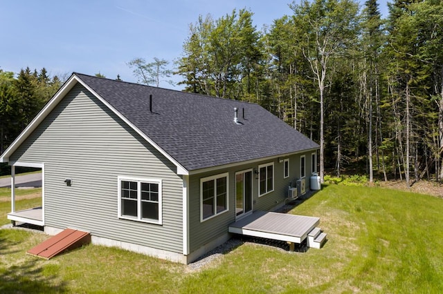 59 Sagamore Dr Lot 28, Phippsburg, ME 04562 - back of property with roof with shingles, a yard, and a wooden deck