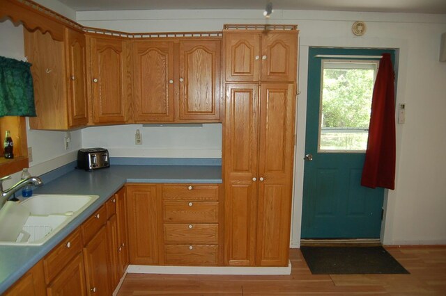 803 Main Rd, Burlington, ME 04417 - kitchen featuring brown cabinets and light wood finished floors