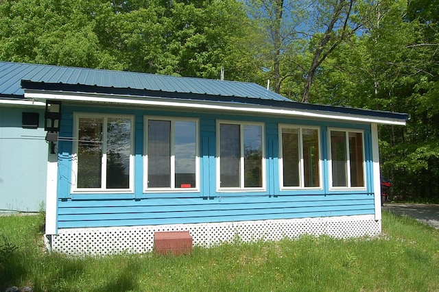 803 Main Rd, Burlington, ME 04417 - view of side of home with a metal roof