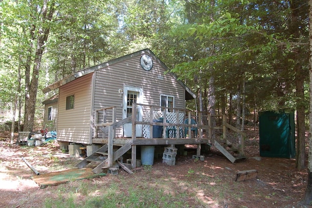 803 Main Rd, Burlington, ME 04417 - rear view of house with stairway and a deck