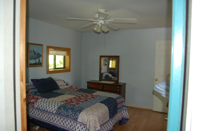 803 Main Rd, Burlington, ME 04417 - bedroom with wood finished floors and ceiling fan
