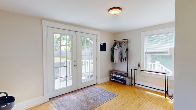 295 French St, Bangor, ME 04401 - doorway with french doors and hardwood / wood-style flooring