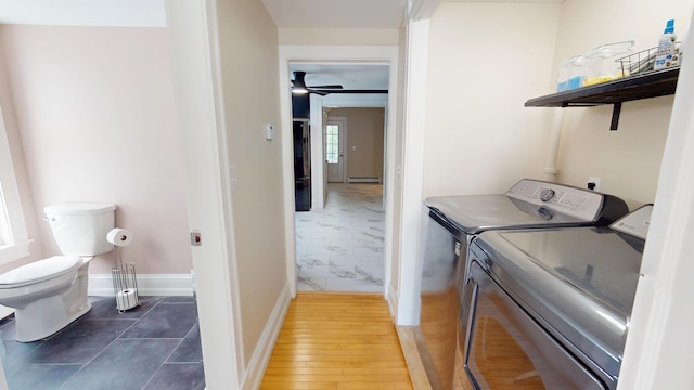 295 French St, Bangor, ME 04401 - washroom with washer and clothes dryer and a baseboard radiator