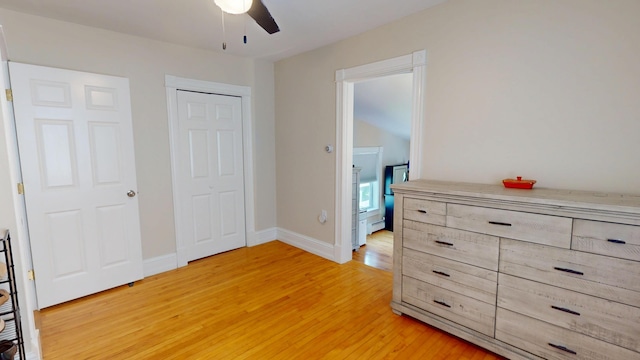 295 French St, Bangor, ME 04401 - bedroom with light wood-style flooring, baseboard heating, a closet, and a ceiling fan