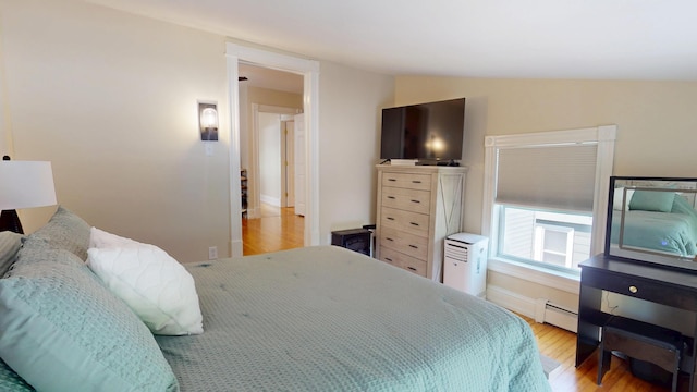 295 French St, Bangor, ME 04401 - bedroom with a baseboard heating unit and light wood finished floors