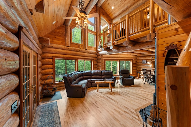 320 Commons Dr, Bridgton, ME 04009 - living area with high vaulted ceiling, plenty of natural light, a wooden ceiling with exposed beams, wood-type flooring, and a ceiling fan