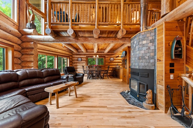 320 Commons Dr, Bridgton, ME 04009 - living room with log walls, hardwood / wood-style floors, and a wood ceiling with exposed beams