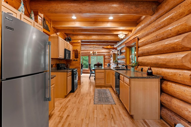 320 Commons Dr, Bridgton, ME 04009 - kitchen with black appliances, light wood-style flooring, dark countertops, light brown cabinetry, and recessed lighting