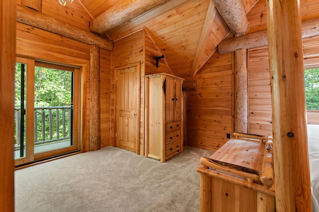 320 Commons Dr, Bridgton, ME 04009 - unfurnished bedroom with lofted ceiling, multiple windows, wooden walls, carpet floors, and wood ceiling