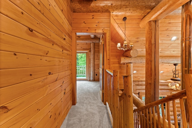 320 Commons Dr, Bridgton, ME 04009 - corridor featuring an upstairs landing, carpet flooring, a chandelier, and wood walls
