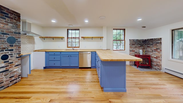 14 Pond St, Orono, ME 04473 - kitchen with open shelves, wooden counters, dishwasher, blue cabinetry, and wall chimney range hood