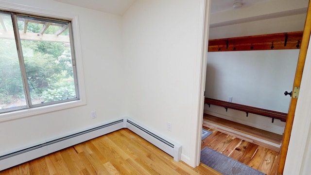 14 Pond St, Orono, ME 04473 - spare room with light wood-type flooring, a baseboard heating unit, and a smoke detector