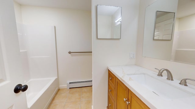 14 Pond St, Orono, ME 04473 - full bath with baseboard heating, vanity, tile patterned flooring, and shower / tub combination