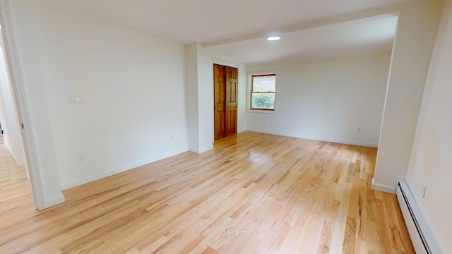 14 Pond St, Orono, ME 04473 - empty room featuring baseboard heating, light wood-type flooring, and recessed lighting