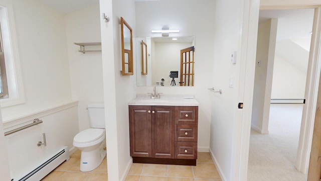 14 Pond St, Orono, ME 04473 - bathroom with a baseboard radiator, vanity, baseboard heating, and tile patterned floors