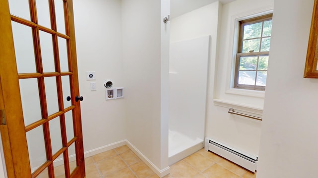 14 Pond St, Orono, ME 04473 - washroom featuring a baseboard radiator, electric dryer hookup, washer hookup, and light tile patterned floors