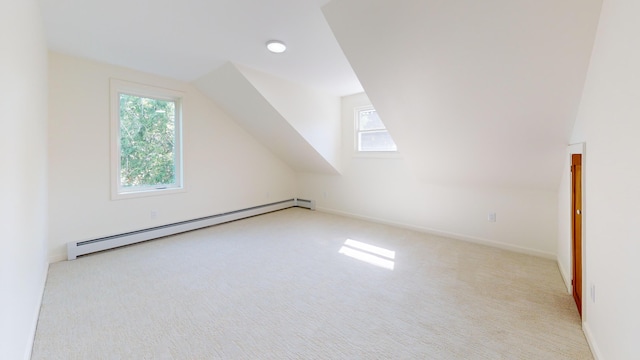 14 Pond St, Orono, ME 04473 - bonus room with a baseboard radiator, plenty of natural light, carpet floors, and vaulted ceiling
