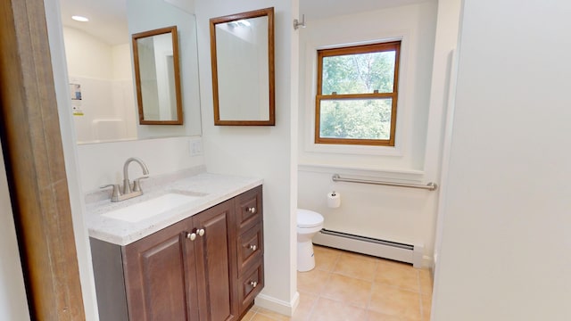 14 Pond St, Orono, ME 04473 - bathroom with baseboard heating, vanity, and tile patterned floors