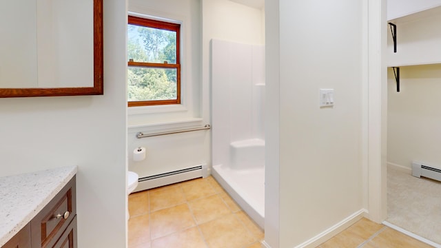 14 Pond St, Orono, ME 04473 - full bathroom featuring a baseboard heating unit, vanity, a shower, and tile patterned floors