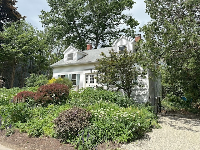 14 Pond St, Orono, ME 04473 - cape cod-style house with a chimney