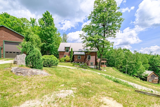 309A Cushman Rd, Woodstock, ME 04219 - view of green lawn featuring a garage