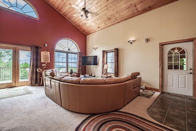 309A Cushman Rd, Woodstock, ME 04219 - living room with high vaulted ceiling, carpet floors, wooden ceiling, ceiling fan, and a baseboard radiator