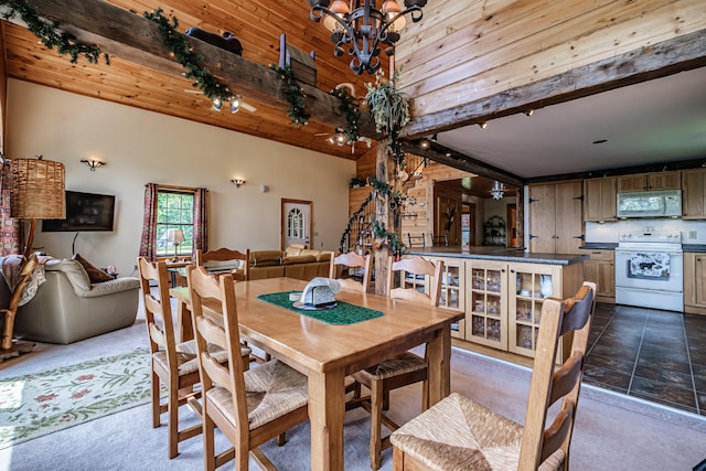 309A Cushman Rd, Woodstock, ME 04219 - dining area with a chandelier and dark colored carpet