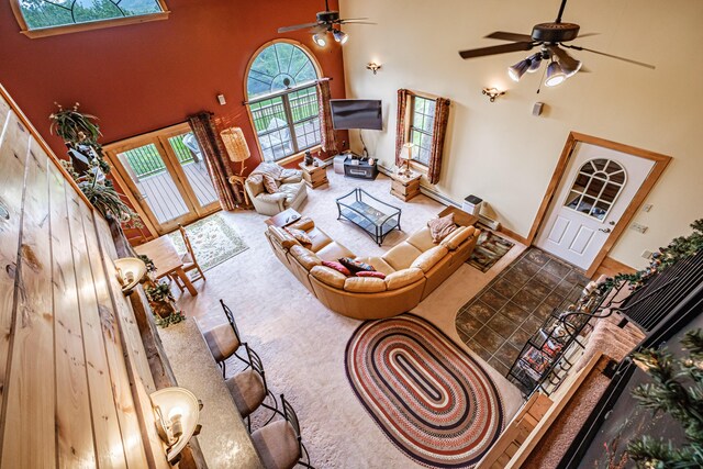 309A Cushman Rd, Woodstock, ME 04219 - carpeted living area featuring a ceiling fan and a towering ceiling