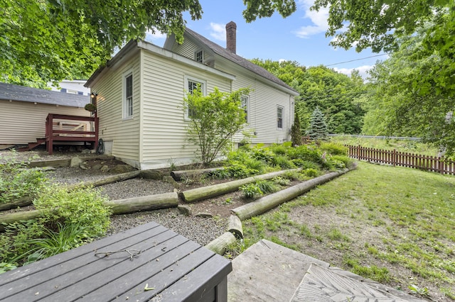 12 Robinson St, Gardiner, ME 04345 - back of house with a deck and a chimney