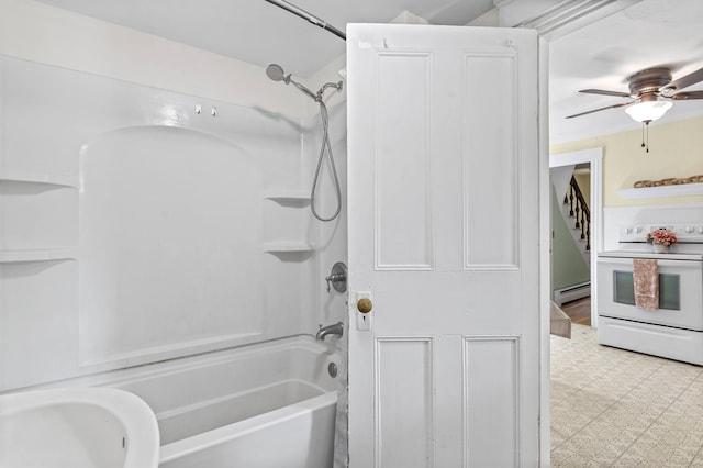 12 Robinson St, Gardiner, ME 04345 - bathroom with a baseboard radiator, washtub / shower combination, a ceiling fan, and tile patterned floors