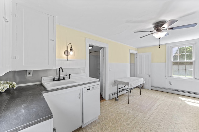 12 Robinson St, Gardiner, ME 04345 - kitchen with a baseboard heating unit, a wainscoted wall, white cabinetry, white dishwasher, and ceiling fan