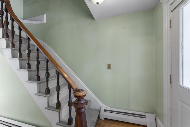 12 Robinson St, Gardiner, ME 04345 - staircase with a baseboard radiator and wood finished floors