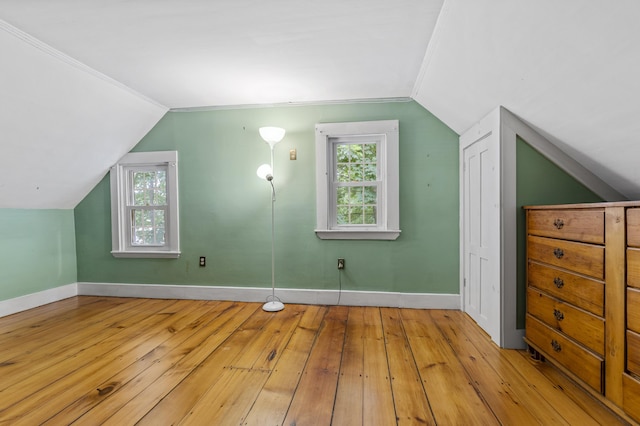12 Robinson St, Gardiner, ME 04345 - bonus room with light wood-style floors, lofted ceiling, and plenty of natural light