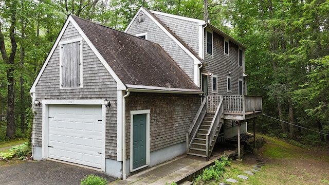 326 Meetinghouse Rd, Wells, ME 04090 - view of property exterior with stairs, a detached garage, a deck, and a shingled roof