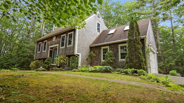 326 Meetinghouse Rd, Wells, ME 04090 - view of front facade with a garage, a front yard, and roof with shingles
