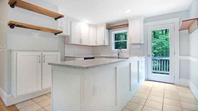326 Meetinghouse Rd, Wells, ME 04090 - kitchen featuring light tile patterned flooring, white cabinetry, tasteful backsplash, light stone counters, and recessed lighting