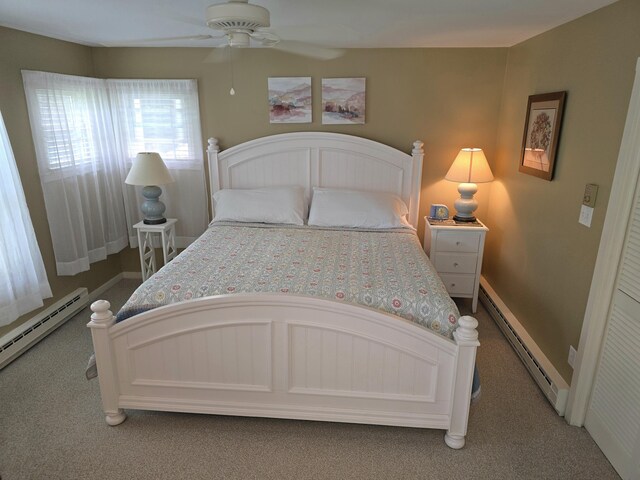 135 Hotel Rd, Auburn, ME 04210 - bedroom featuring a baseboard radiator, light carpet, baseboard heating, and ceiling fan