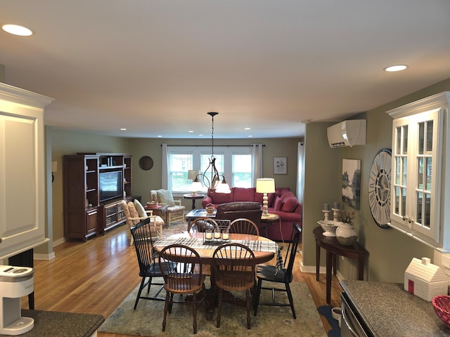 135 Hotel Rd, Auburn, ME 04210 - dining space with a wall mounted AC, wood finished floors, and recessed lighting