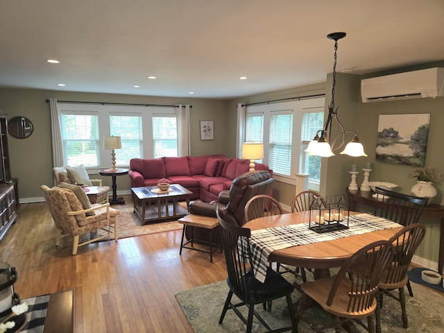 135 Hotel Rd, Auburn, ME 04210 - dining room featuring a wall mounted air conditioner, plenty of natural light, light wood finished floors, and recessed lighting