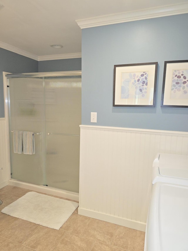 135 Hotel Rd, Auburn, ME 04210 - full bathroom with wainscoting, a stall shower, crown molding, and tile patterned flooring
