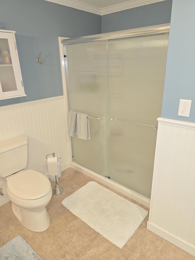 135 Hotel Rd, Auburn, ME 04210 - full bathroom featuring a wainscoted wall, a shower stall, tile patterned floors, and crown molding