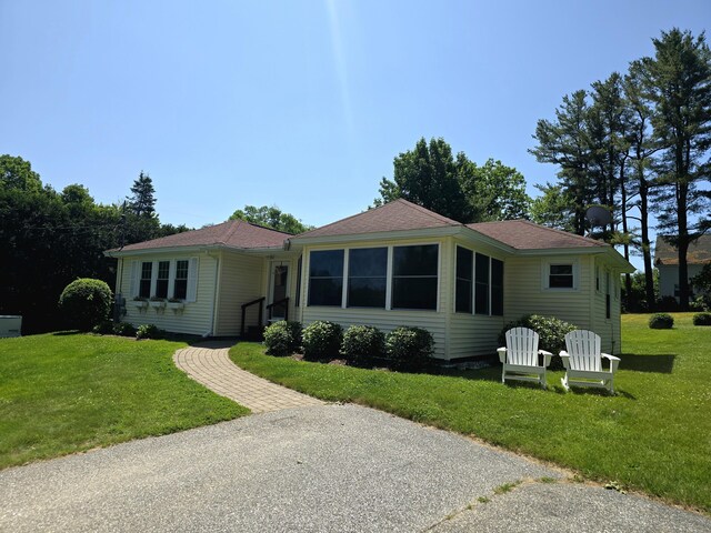 135 Hotel Rd, Auburn, ME 04210 - ranch-style house featuring a front lawn and a shingled roof