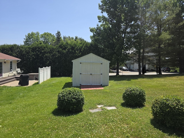 135 Hotel Rd, Auburn, ME 04210 - view of grassy yard featuring a storage unit and a patio