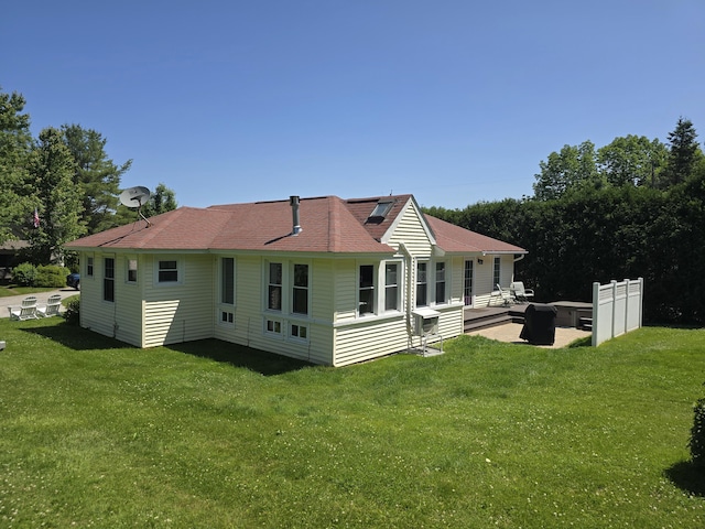 135 Hotel Rd, Auburn, ME 04210 - rear view of property with a patio area, a lawn, and roof with shingles