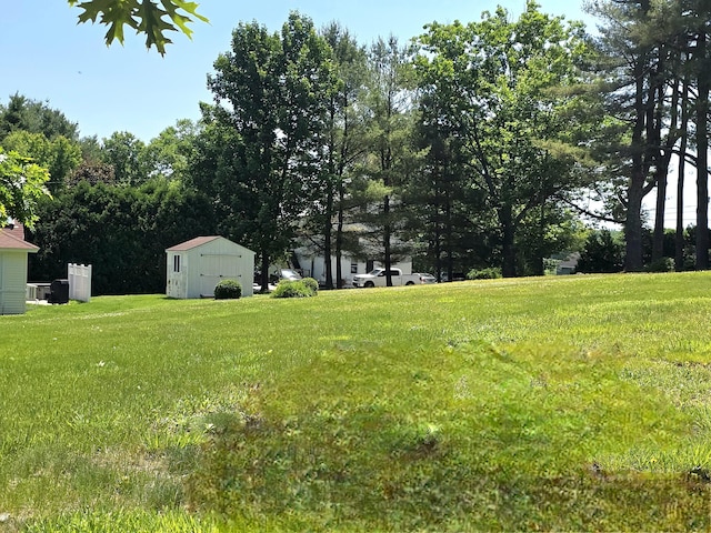 135 Hotel Rd, Auburn, ME 04210 - view of green lawn with a shed