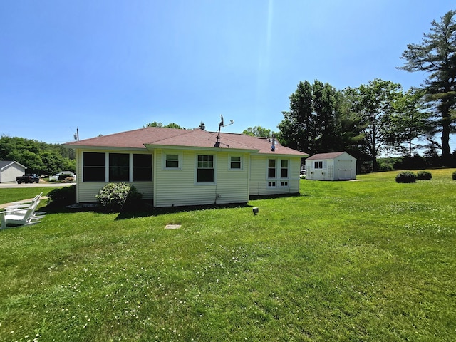 135 Hotel Rd, Auburn, ME 04210 - back of house with a storage shed and a lawn