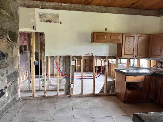 754 US Route 1, Weston, ME 04424 - kitchen featuring light tile patterned floors, wood ceiling, and dark countertops